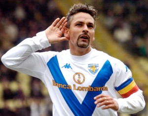 Brescia soccer star Roberto Baggio celebrates after scoring during the Italian first division soccer match between Parma and Brescia at the Tardini stadium in Parma, Italy, Sunday, March 14, 2004. Baggio scored his 200th goal. (AP Photo/Marco Vasini)