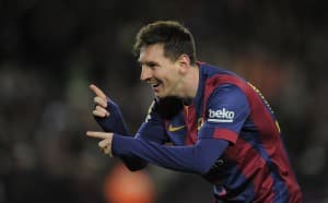 FC Barcelona's Lionel Messi, from Argentina, reacts after scoring during a Spanish La Liga soccer match against Espanyol at the Camp Nou stadium in Barcelona, Spain, Sunday, Dec. 7, 2014. (AP Photo/Manu Fernandez)